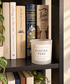 Glacier Peak Ritual Refill candle styled on a bookshelf