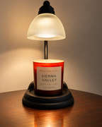 Sienna Valley Ritual Refill candle beneath a glowing candle warmer lamp; warmer not included
