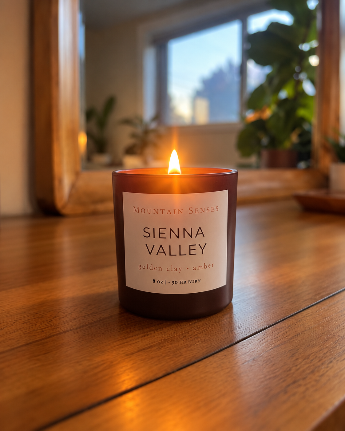 Sienna Valley 8 oz Ritual Refill candle with glowing wooden wick on a wooden table
