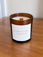 Sunstone Canyon 8 oz Ritual Refill candle with unlit wooden wick on a wooden table
